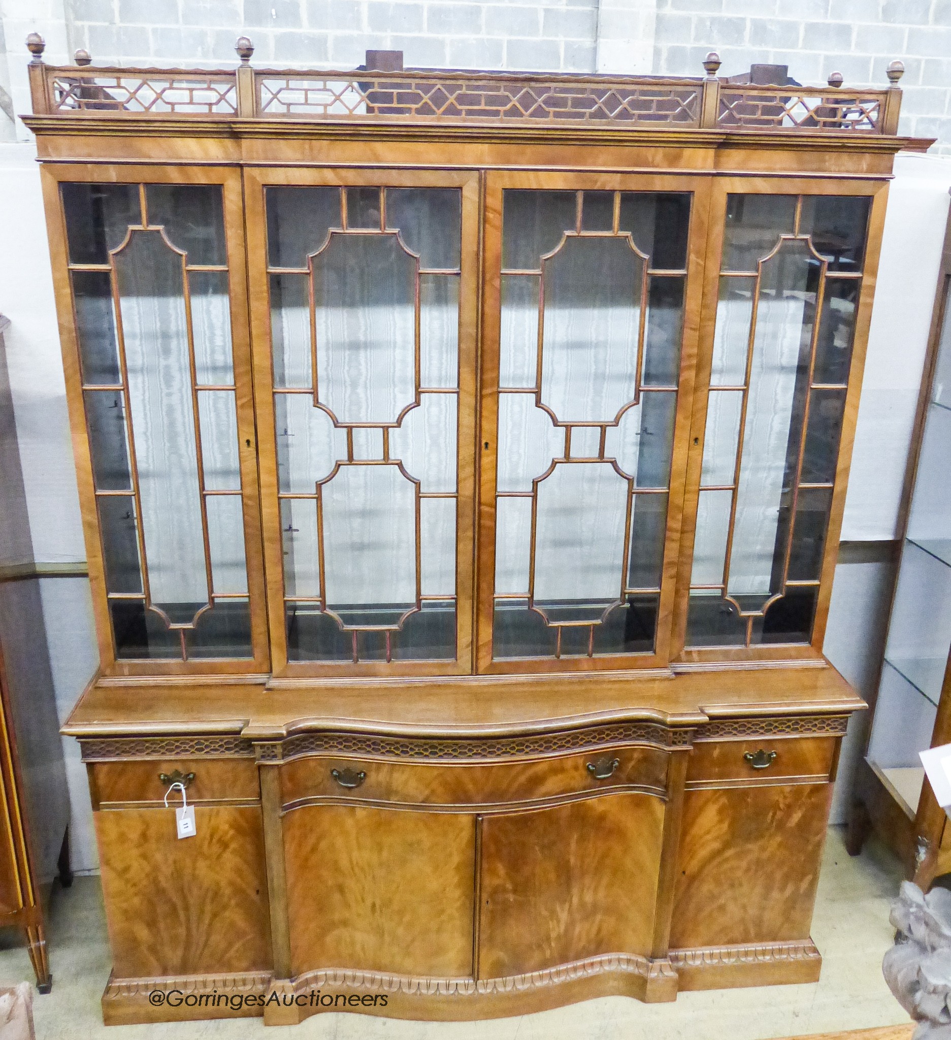 A Georgian style mahogany serpentine front library bookcase, width 160cm, depth 50cm, height 198cm